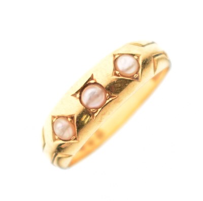 Lot 22 - Late Victorian / Edwardian 18ct gold ring set three seed pearls