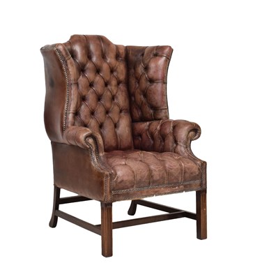 Lot 488 - George III style mahogany-framed deep-buttoned wing armchair