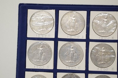 Lot 191 - Sixteen silver Britannia British Trade One Dollars