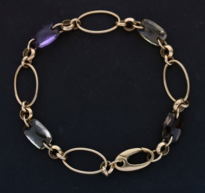 Lot 63 - Amethyst, citrine, and smokey quartz 9ct gold bracelet