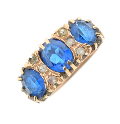 Lot 20 - Dress ring set three blue stones and six white stones