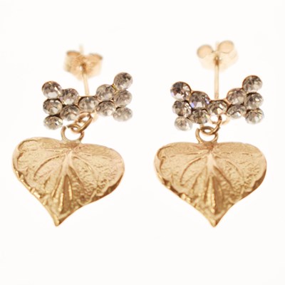 Lot 83 - Pair of leaf and crystal decorated yellow metal earrings