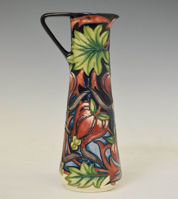 Lot 399 - Moorcroft Pottery - 'Red Ribbons' pattern slender jug