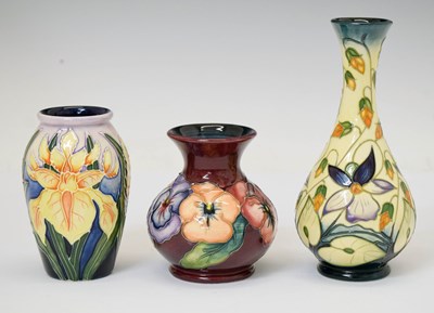 Lot 402 - Moorcroft Pottery - 'Sweet Thief' pattern bud vase, and two others