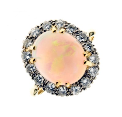 Lot 28 - Opal and diamond 18ct gold cluster ring
