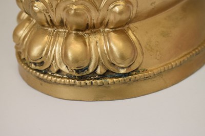 Lot 565 - Himalayan gilt alloy figure of Buddha Shakyamuni
