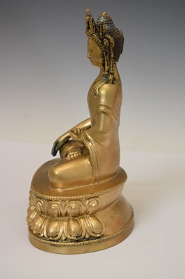 Lot 565 - Himalayan gilt alloy figure of Buddha Shakyamuni