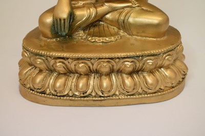 Lot 565 - Himalayan gilt alloy figure of Buddha Shakyamuni