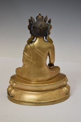Lot 565 - Himalayan gilt alloy figure of Buddha Shakyamuni