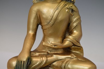 Lot 565 - Himalayan gilt alloy figure of Buddha Shakyamuni