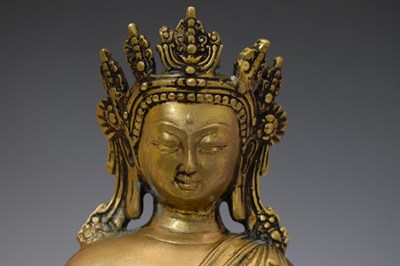 Lot 565 - Himalayan gilt alloy figure of Buddha Shakyamuni