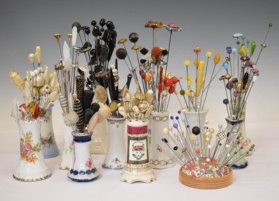 Lot 111 - Large collection of hat pins in twelve ceramic holders