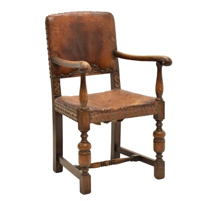 Lot 645 - Early 20th century tan leather and studwork open armchair