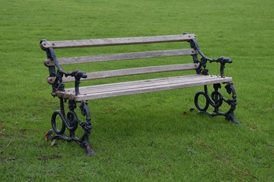 Lot 657 - Two-seater slatted wooden garden bench