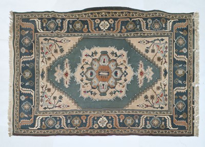 Lot 576 - Machine-made Eastern-style wool rug