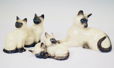 Lot 392 - Four Beswick and Doulton Siamese cats