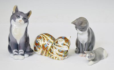 Lot 419 - Three Royal Copenhagen porcelain cats and a Royal Crown Derby cat