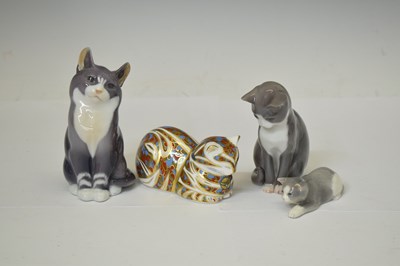 Lot 419 - Three Royal Copenhagen porcelain cats and a Royal Crown Derby cat