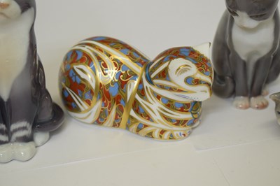 Lot 419 - Three Royal Copenhagen porcelain cats and a Royal Crown Derby cat