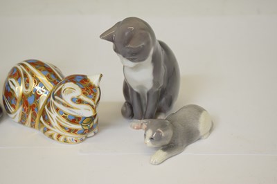 Lot 419 - Three Royal Copenhagen porcelain cats and a Royal Crown Derby cat