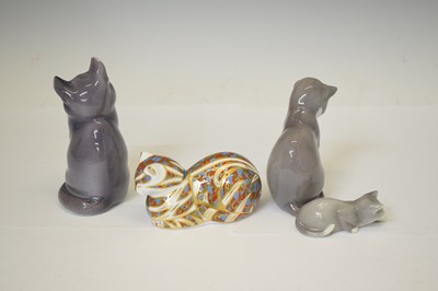 Lot 419 - Three Royal Copenhagen porcelain cats and a Royal Crown Derby cat