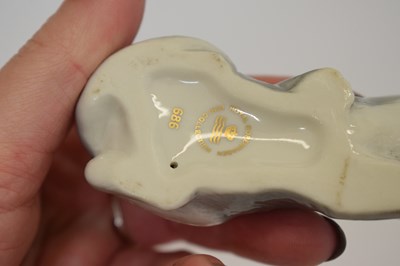 Lot 419 - Three Royal Copenhagen porcelain cats and a Royal Crown Derby cat