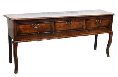 Lot 385 - George III oak low dresser on cabriole supports