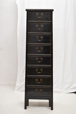 Lot 324 - Chinese black painted tall chest of eight drawers