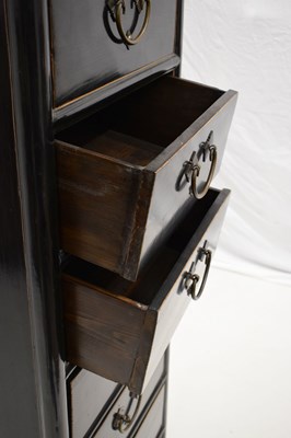 Lot 324 - Chinese black painted tall chest of eight drawers