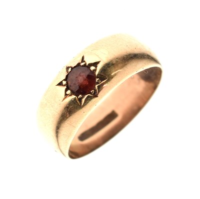 Lot 9 - Gypsy set garnet-coloured stone yellow metal ring