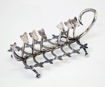 Lot 130 - Victorian silver novelty toast rack with leaf decoration