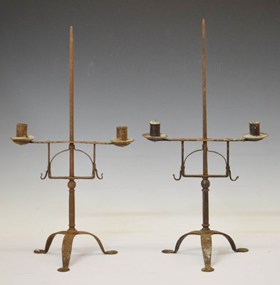 Lot 211 - Pair of wrought iron candle stands