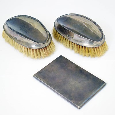 Lot 122 - George V silver cigarette case, together with a pair of George V silver-backed brushes