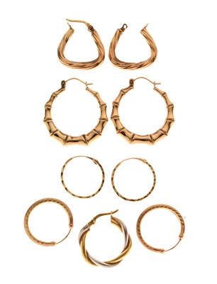 Lot 63 - Four pairs of 9ct gold and yellow metal hoop earrings