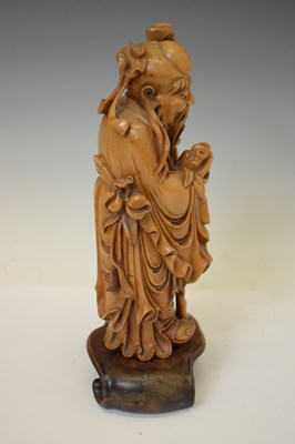 Lot 313 - Chinese carved rootwood figure of Shoulao and blanc de chine Kwanyin