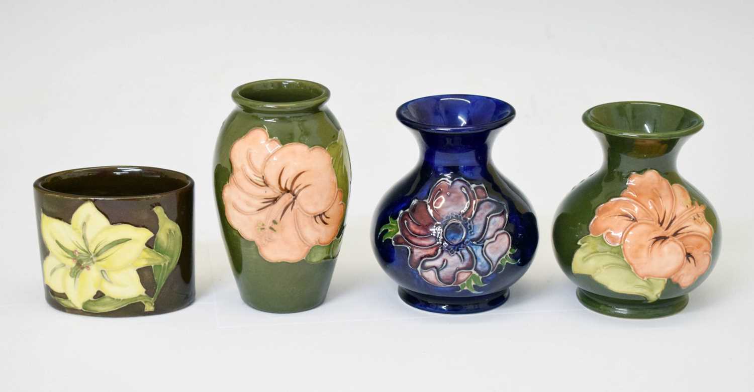 Lot 364 - Moorcroft pottery - An 'Anemone' ovoid vase, two 'Hibiscus' pattern, and a 'Bermuda Lily' vase
