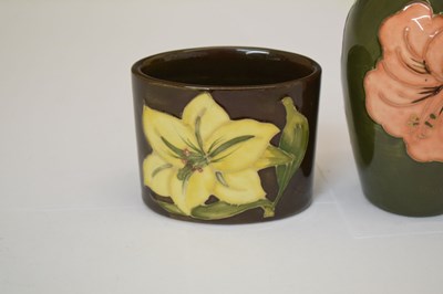 Lot 364 - Moorcroft pottery - An 'Anemone' ovoid vase, two 'Hibiscus' pattern, and a 'Bermuda Lily' vase