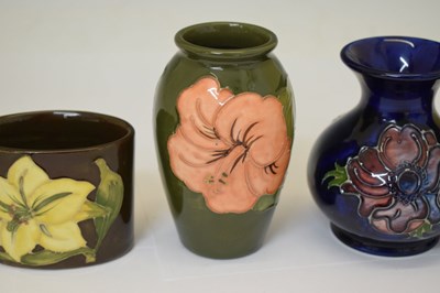 Lot 364 - Moorcroft pottery - An 'Anemone' ovoid vase, two 'Hibiscus' pattern, and a 'Bermuda Lily' vase