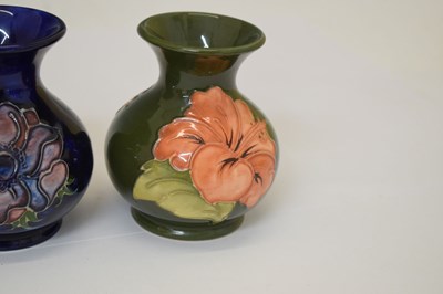 Lot 364 - Moorcroft pottery - An 'Anemone' ovoid vase, two 'Hibiscus' pattern, and a 'Bermuda Lily' vase