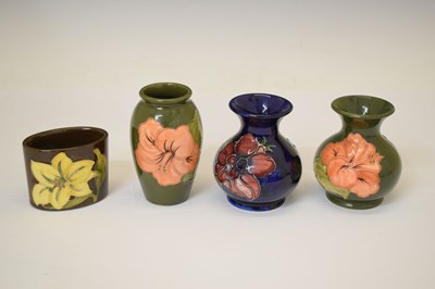 Lot 364 - Moorcroft pottery - An 'Anemone' ovoid vase, two 'Hibiscus' pattern, and a 'Bermuda Lily' vase