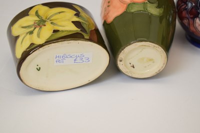 Lot 364 - Moorcroft pottery - An 'Anemone' ovoid vase, two 'Hibiscus' pattern, and a 'Bermuda Lily' vase