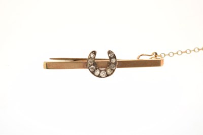 Lot 42 - Diamond lucky horseshoe 9ct gold bar brooch