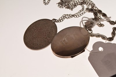 Lot 73 - Engraved silver oval locket on a '925' silver rope chain