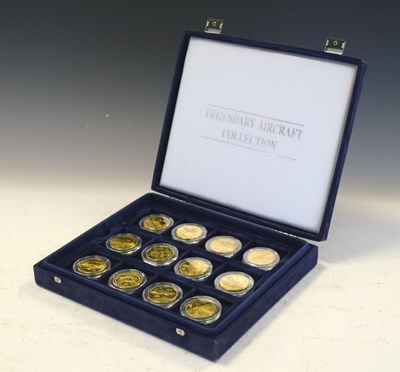 Lot 219 - Set of 24 x The Legendary Aircraft Collection Brass Coins in display case