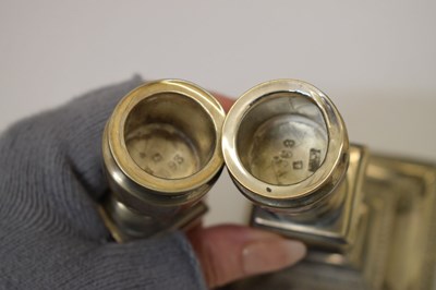 Lot 159 - Pair of silver candlesticks in the neoclassical taste of square columner form
