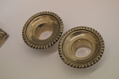 Lot 159 - Pair of silver candlesticks in the neoclassical taste of square columner form