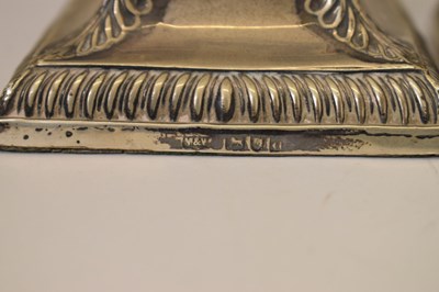 Lot 159 - Pair of silver candlesticks in the neoclassical taste of square columner form