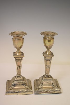 Lot 159 - Pair of silver candlesticks in the neoclassical taste of square columner form