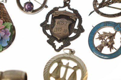 Lot 205 - Elizabeth II silver cigar cutter, silver fob, selection of silver brooches and white metal examples