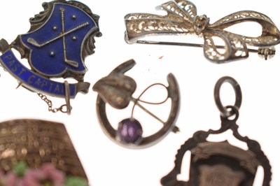 Lot 205 - Elizabeth II silver cigar cutter, silver fob, selection of silver brooches and white metal examples